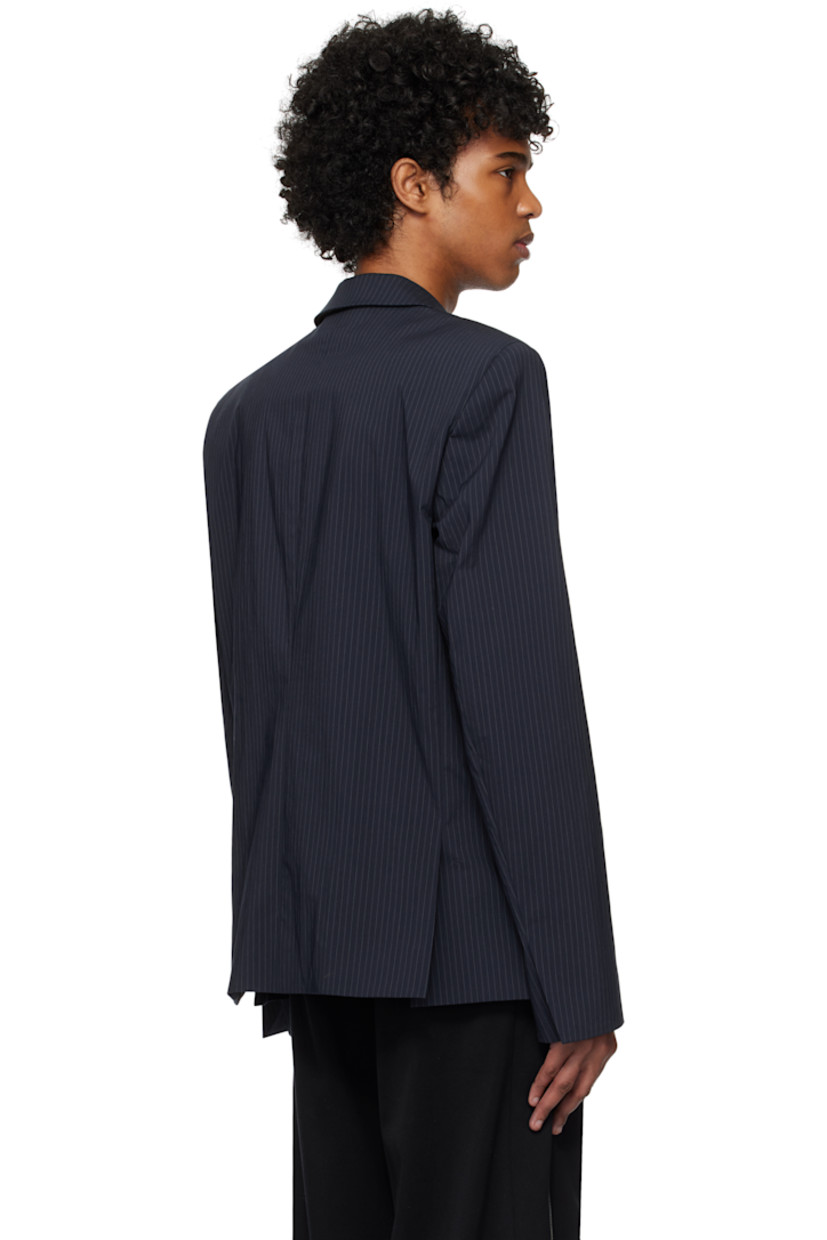 Stretch cotton- and nylon-blend twill blazer. Pinstripes throughout. 

· Peaked lapel
· Button closure
· Welt pocket at chest
· Curved slit at front
· Flap pockets at waist
· Padded shoulders
· Vent at cuffs
· Twin vents at back hem 
· Welt pocket at interior 
· Full satin lining 

Supplier color: Navy striped