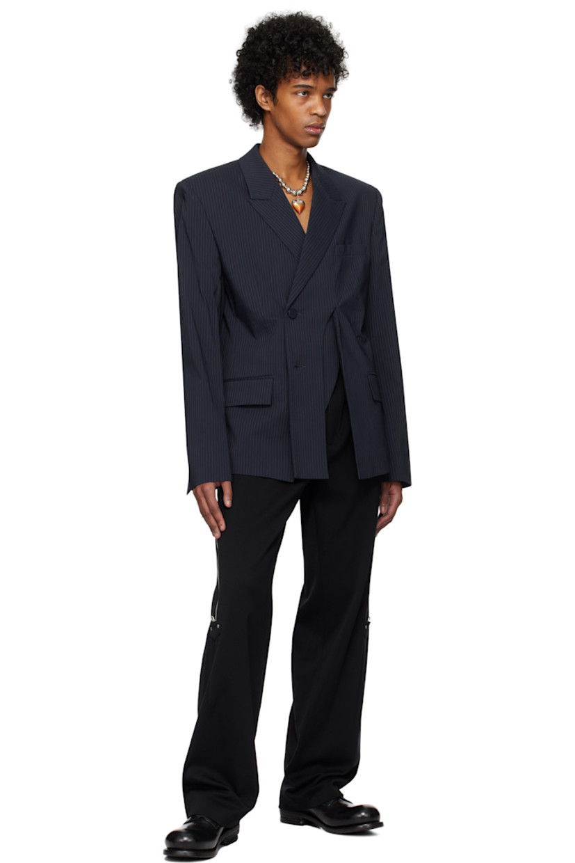 Stretch cotton- and nylon-blend twill blazer. Pinstripes throughout. 

· Peaked lapel
· Button closure
· Welt pocket at chest
· Curved slit at front
· Flap pockets at waist
· Padded shoulders
· Vent at cuffs
· Twin vents at back hem 
· Welt pocket at interior 
· Full satin lining 

Supplier color: Navy striped