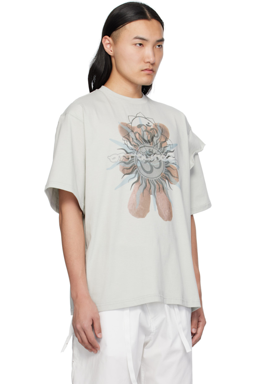 Organic cotton jersey T-shirt.

· Rib-knit crewneck
· Graphic printed at front
· Extended trim with raw edge at shoulder

Supplier color: Grey