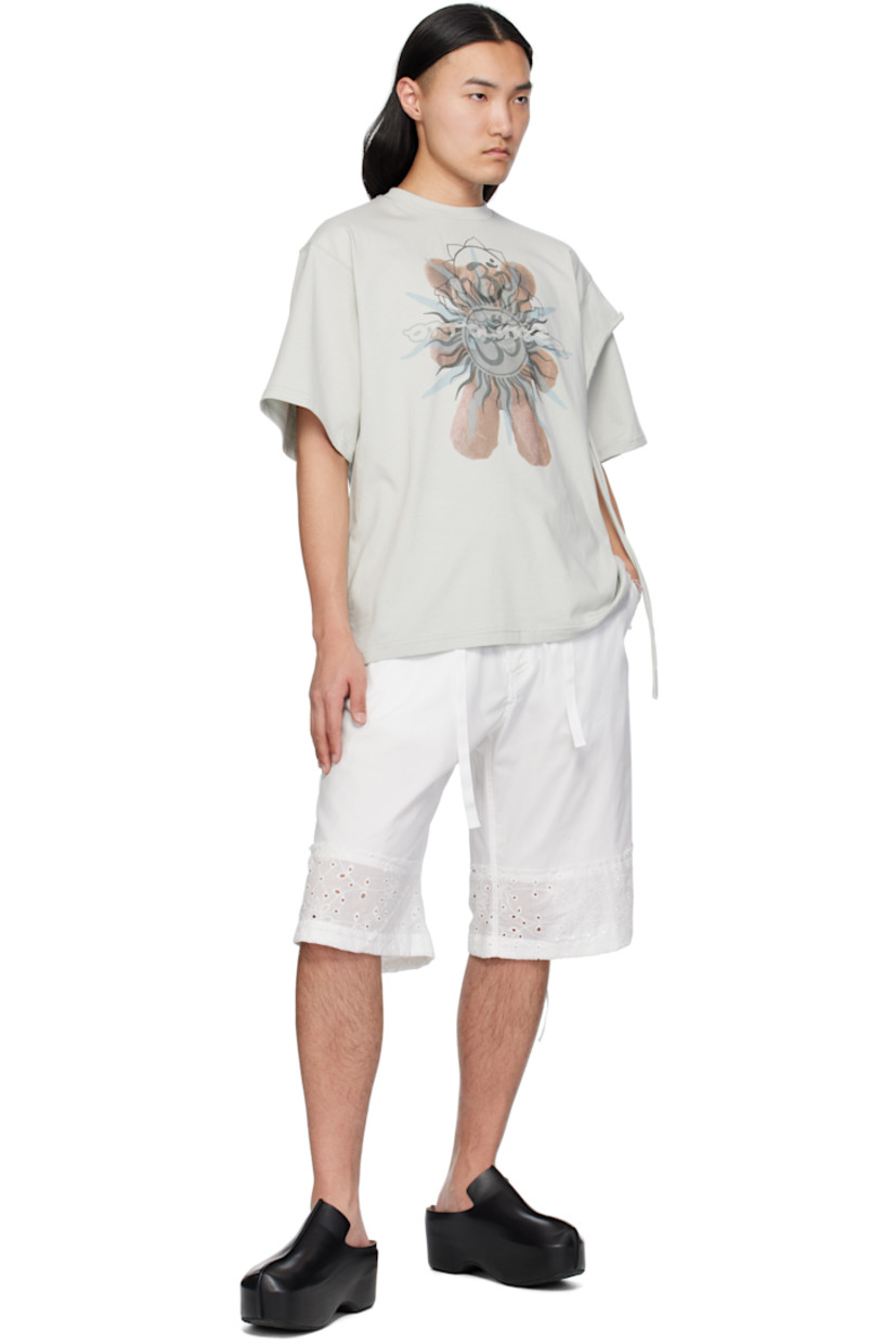 Organic cotton jersey T-shirt.

· Rib-knit crewneck
· Graphic printed at front
· Extended trim with raw edge at shoulder

Supplier color: Grey
