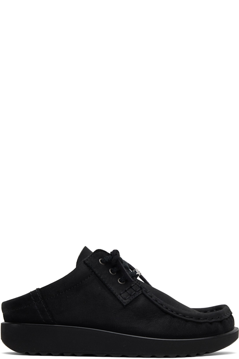 Nubuck mules in black. 

· Moc toe
· Logo hardware at lace-up closure
· Logo stamp at tongue
· Padded collar
· Foam rubber midsole
· Treaded rubber sole

Part of the Ottolinger x ECCO.kollektive collaboration.

Supplier color: Black
