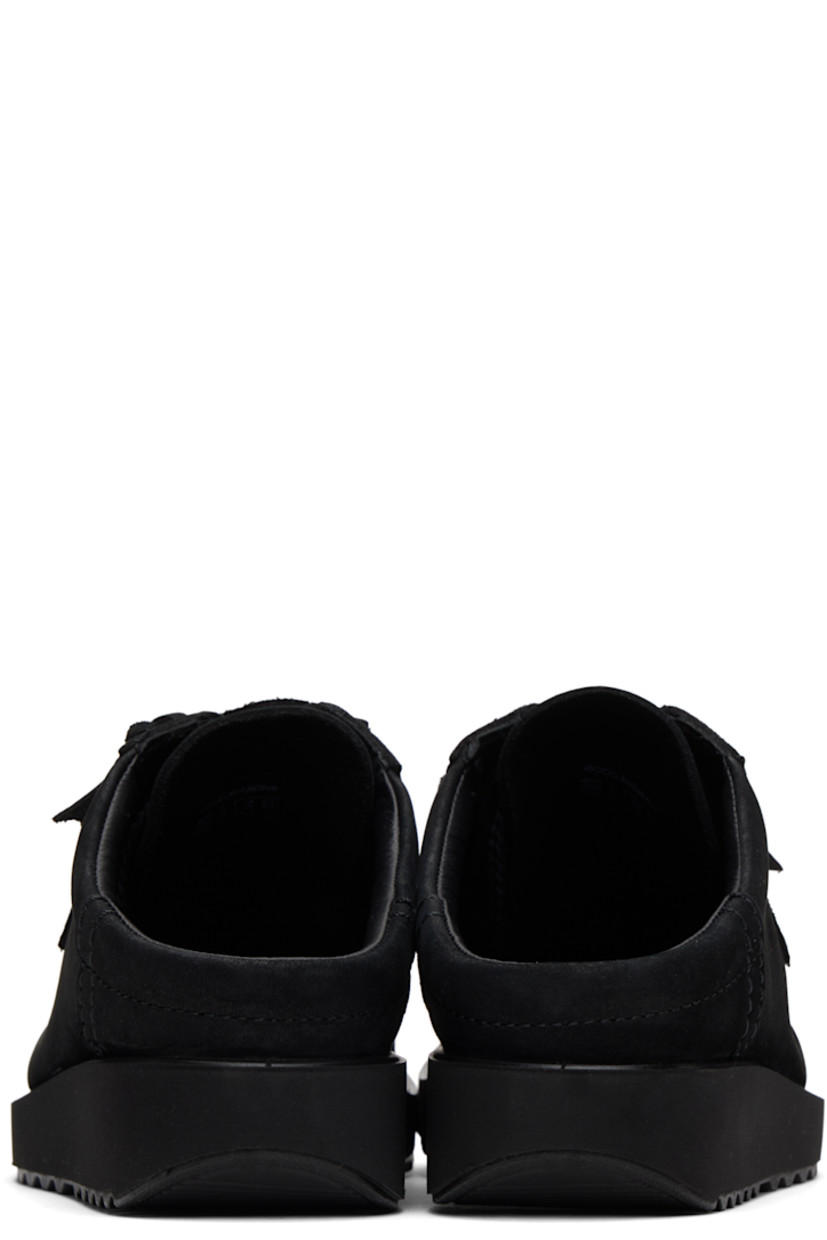 Nubuck mules in black. 

· Moc toe
· Logo hardware at lace-up closure
· Logo stamp at tongue
· Padded collar
· Foam rubber midsole
· Treaded rubber sole

Part of the Ottolinger x ECCO.kollektive collaboration.

Supplier color: Black