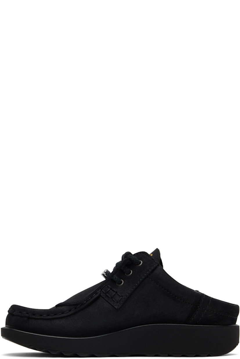 Nubuck mules in black. 

· Moc toe
· Logo hardware at lace-up closure
· Logo stamp at tongue
· Padded collar
· Foam rubber midsole
· Treaded rubber sole

Part of the Ottolinger x ECCO.kollektive collaboration.

Supplier color: Black