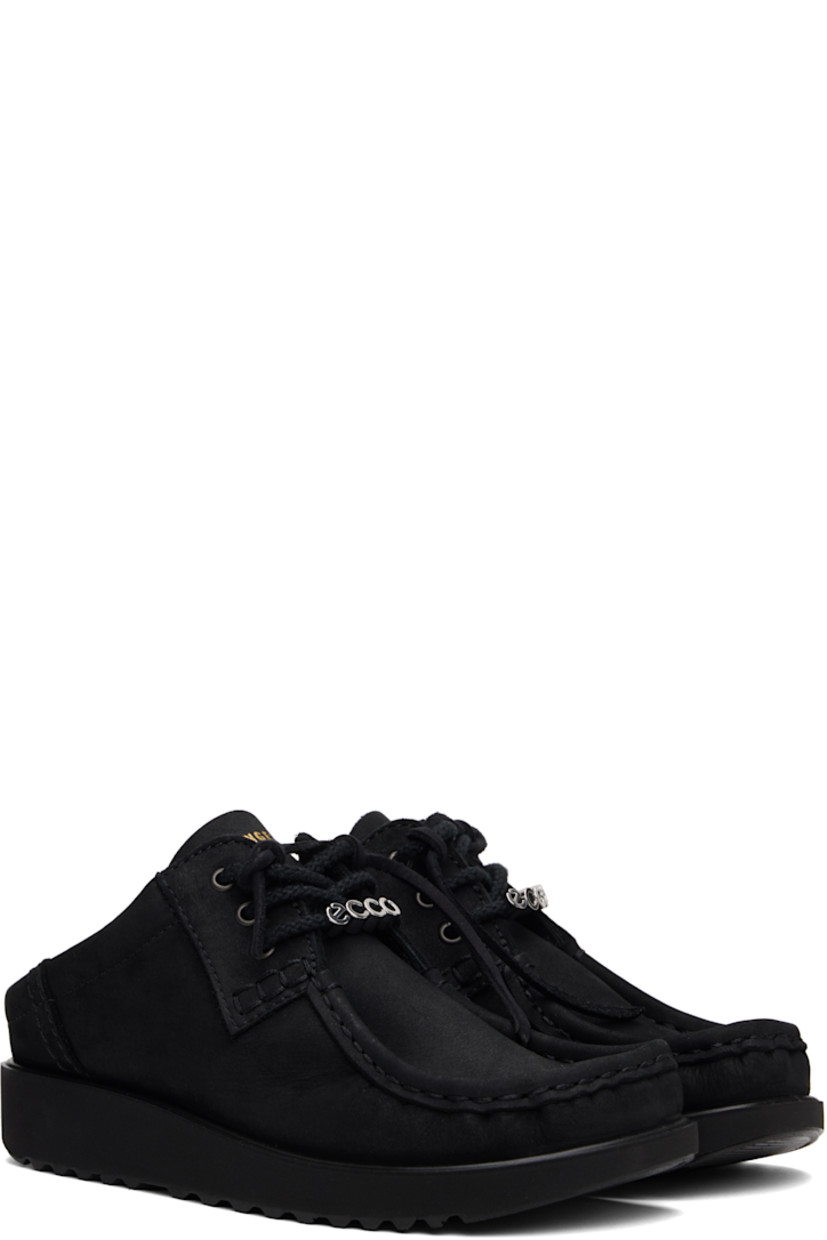 Nubuck mules in black. 

· Moc toe
· Logo hardware at lace-up closure
· Logo stamp at tongue
· Padded collar
· Foam rubber midsole
· Treaded rubber sole

Part of the Ottolinger x ECCO.kollektive collaboration.

Supplier color: Black