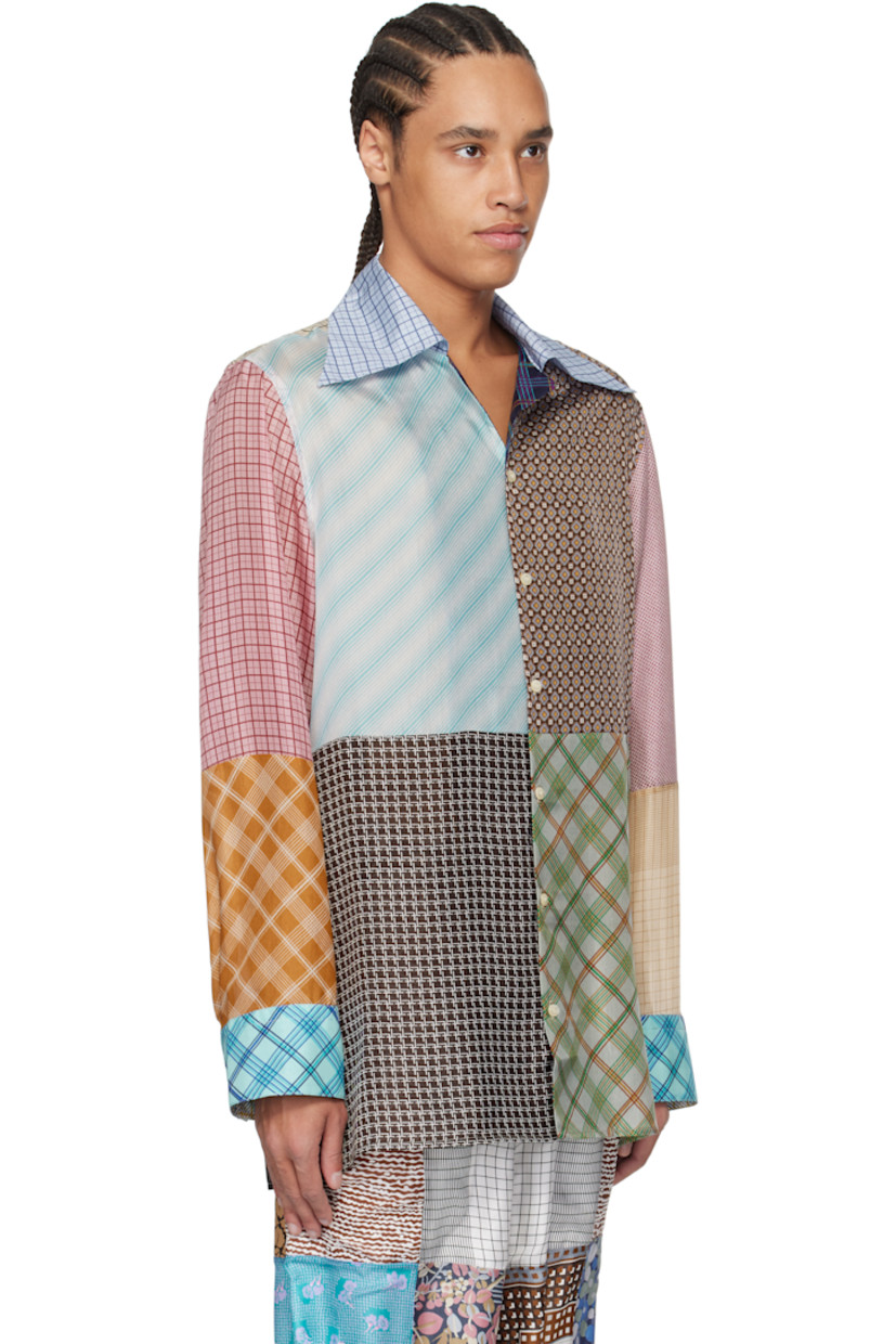 Loose-fit regenerated silk chiffon shirt. Printed graphic patterns throughout.

· Patchwork construction
· Open spread collar
· Button closure
· Buttoned barrel cuffs
· Logo flag at side
· Vent at side seams
· Logo-engraved mother-of-pearl hardware

Each item is unique. Please note that coloration may vary.

Supplier color: Multicolor