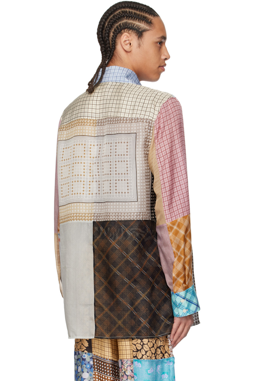 Loose-fit regenerated silk chiffon shirt. Printed graphic patterns throughout.

· Patchwork construction
· Open spread collar
· Button closure
· Buttoned barrel cuffs
· Logo flag at side
· Vent at side seams
· Logo-engraved mother-of-pearl hardware

Each item is unique. Please note that coloration may vary.

Supplier color: Multicolor