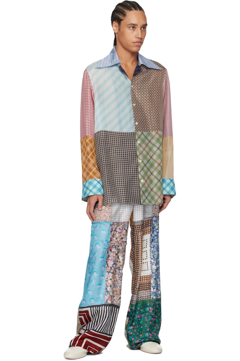 Loose-fit regenerated silk chiffon shirt. Printed graphic patterns throughout.

· Patchwork construction
· Open spread collar
· Button closure
· Buttoned barrel cuffs
· Logo flag at side
· Vent at side seams
· Logo-engraved mother-of-pearl hardware

Each item is unique. Please note that coloration may vary.

Supplier color: Multicolor