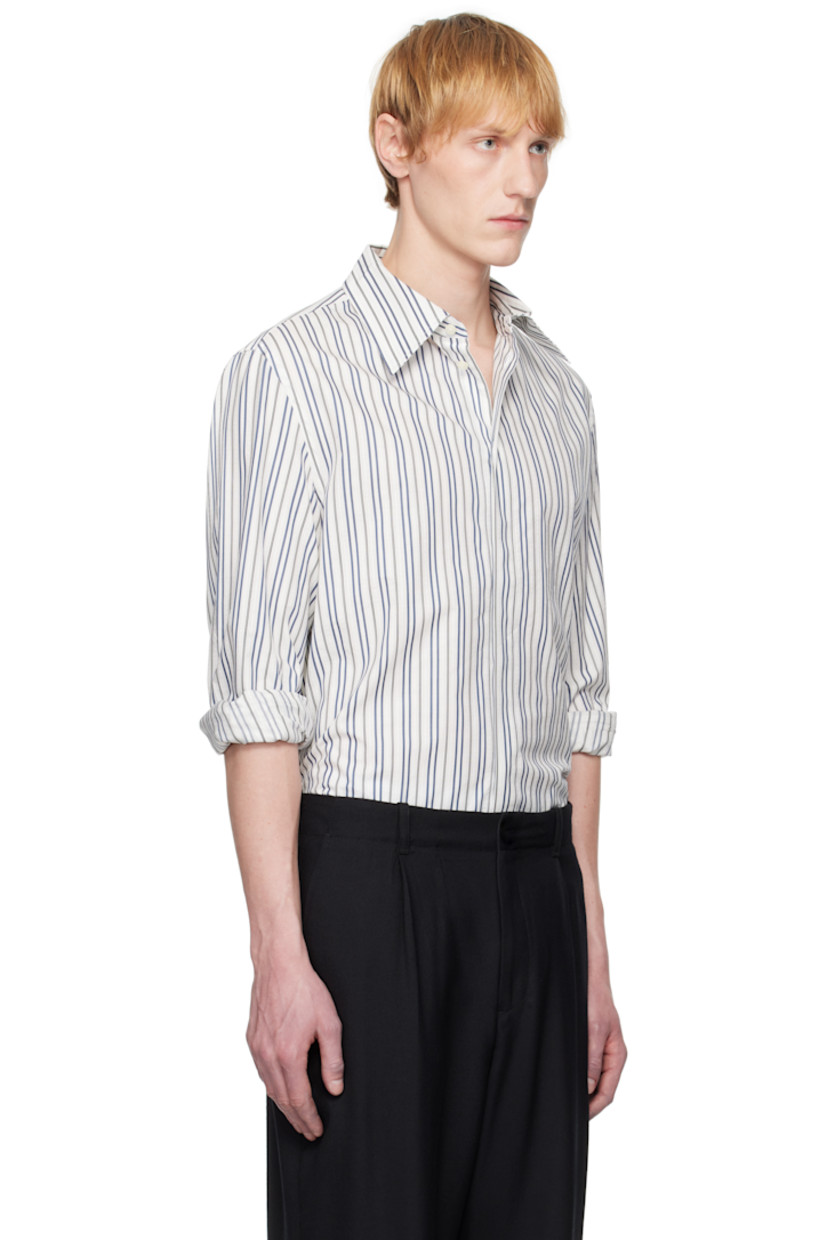 Cotton poplin shirt. Stripes throughout.

· Spread collar
· Button closure
· Buttoned French cuffs
· Logo patch at back yoke

Supplier color: Regenerated striped poplin off white