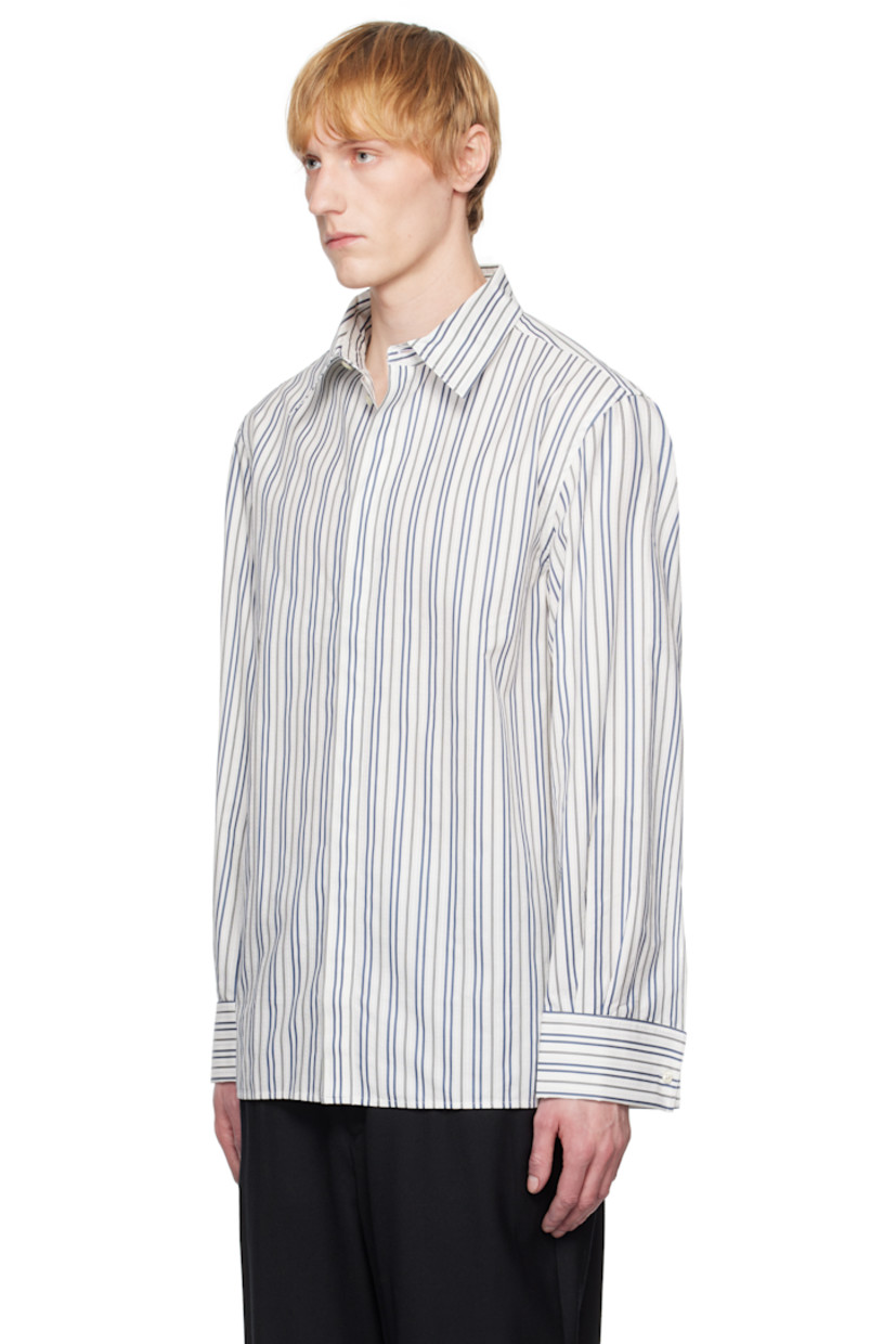 Cotton poplin shirt. Stripes throughout.

· Spread collar
· Button closure
· Buttoned French cuffs
· Logo patch at back yoke

Supplier color: Regenerated striped poplin off white