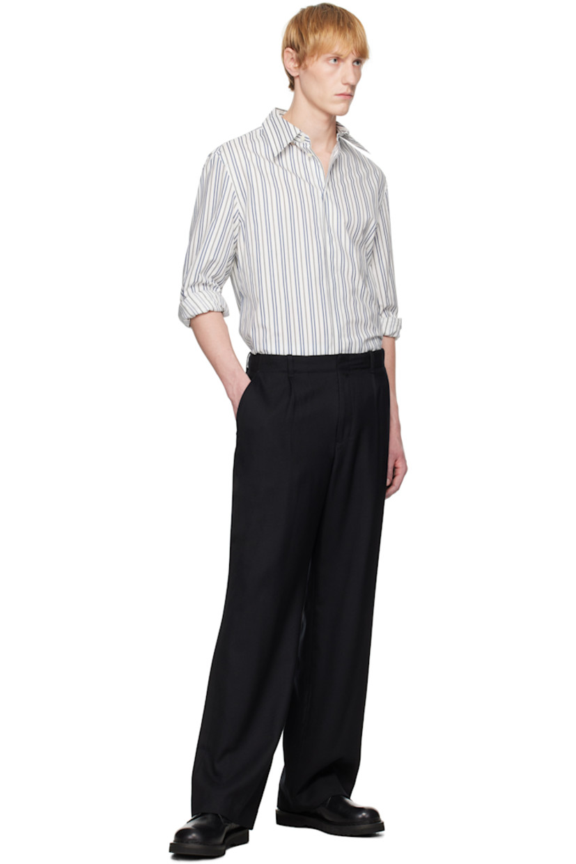 Cotton poplin shirt. Stripes throughout.

· Spread collar
· Button closure
· Buttoned French cuffs
· Logo patch at back yoke

Supplier color: Regenerated striped poplin off white