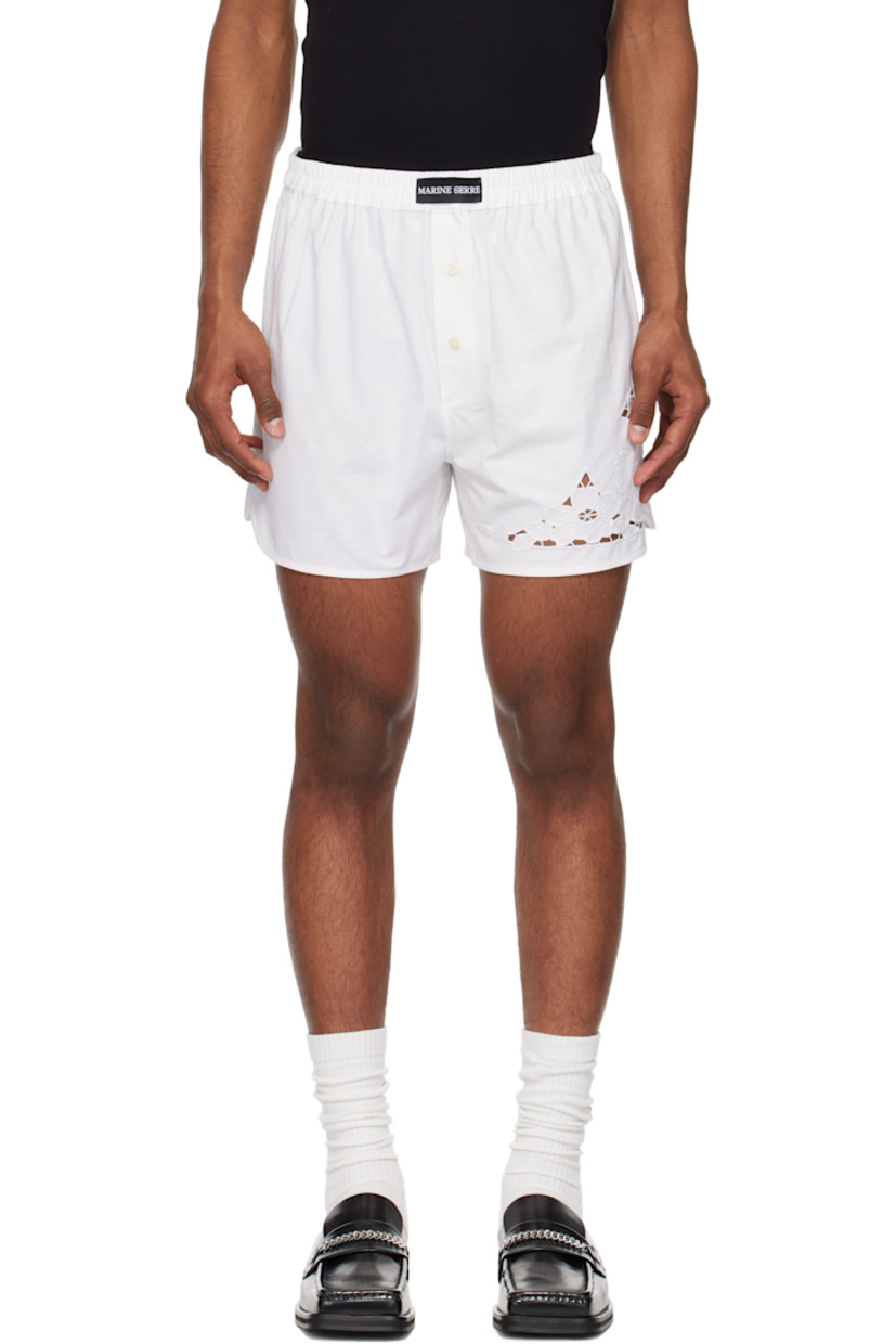 Upcycled cotton hopsack shorts.

· Logo patch at elasticized waistband
· Exposed button fly
· Broderie anglaise detailing at leg
· Vented cuffs

Each item is unique. Please note finishings may vary.

Supplier color: White