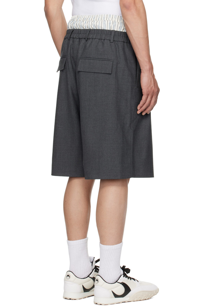 Stretch polyester- and wool-blend twill shorts.

· RWS-certified wool
· Wide-leg
· Elasticized cotton poplin waistband with logo patch
· Belt loops at partially elasticized waistband
· Four-pocket styling
· Zip-fly
· Pleats at front 

Supplier color: Grey