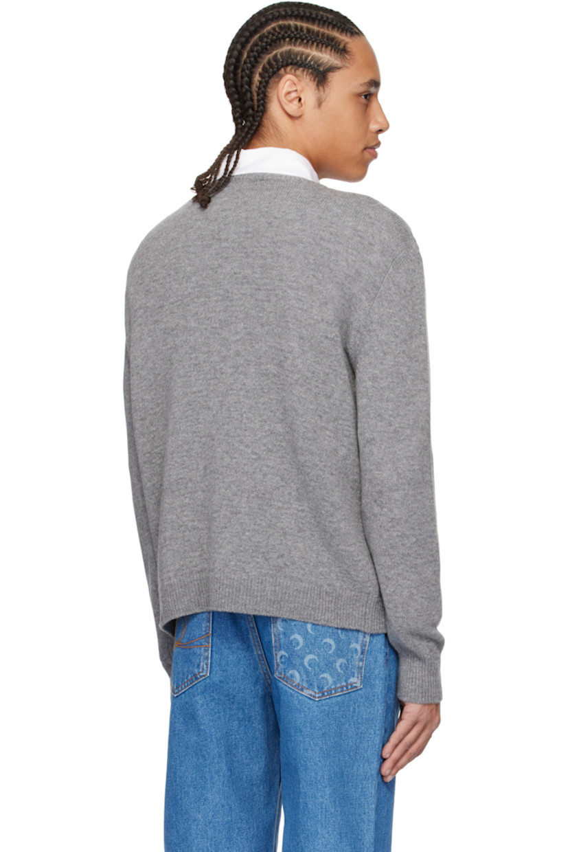 Knit virgin wool sweater.

· Rib-knit crewneck, hem, and cuffs
· Intarsia logo graphic at front

Supplier color: Dark grey