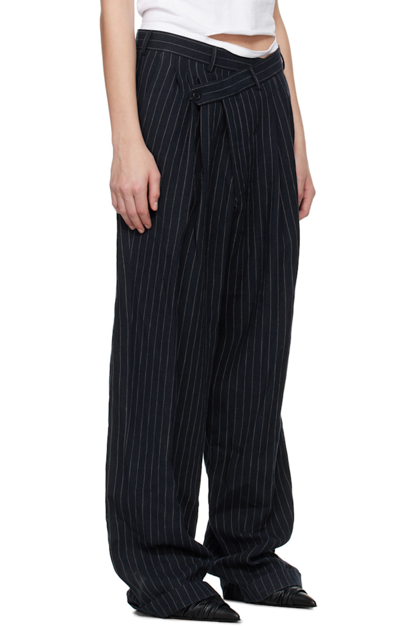 Linen hopsack trousers. Pinstripes throughout. 

· Belt loops
· Four-pocket styling
· Offset button fly 
· Pleats at front 
· Rolled cuffs

Supplier color: Dark navy stripe