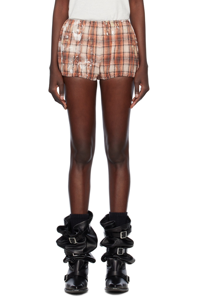 Cotton seersucker shorts. 

· Check pattern and paint splatter throughout
· Elasticized waistband and cuffs

Supplier color: Orange plaid w/ paint splatter