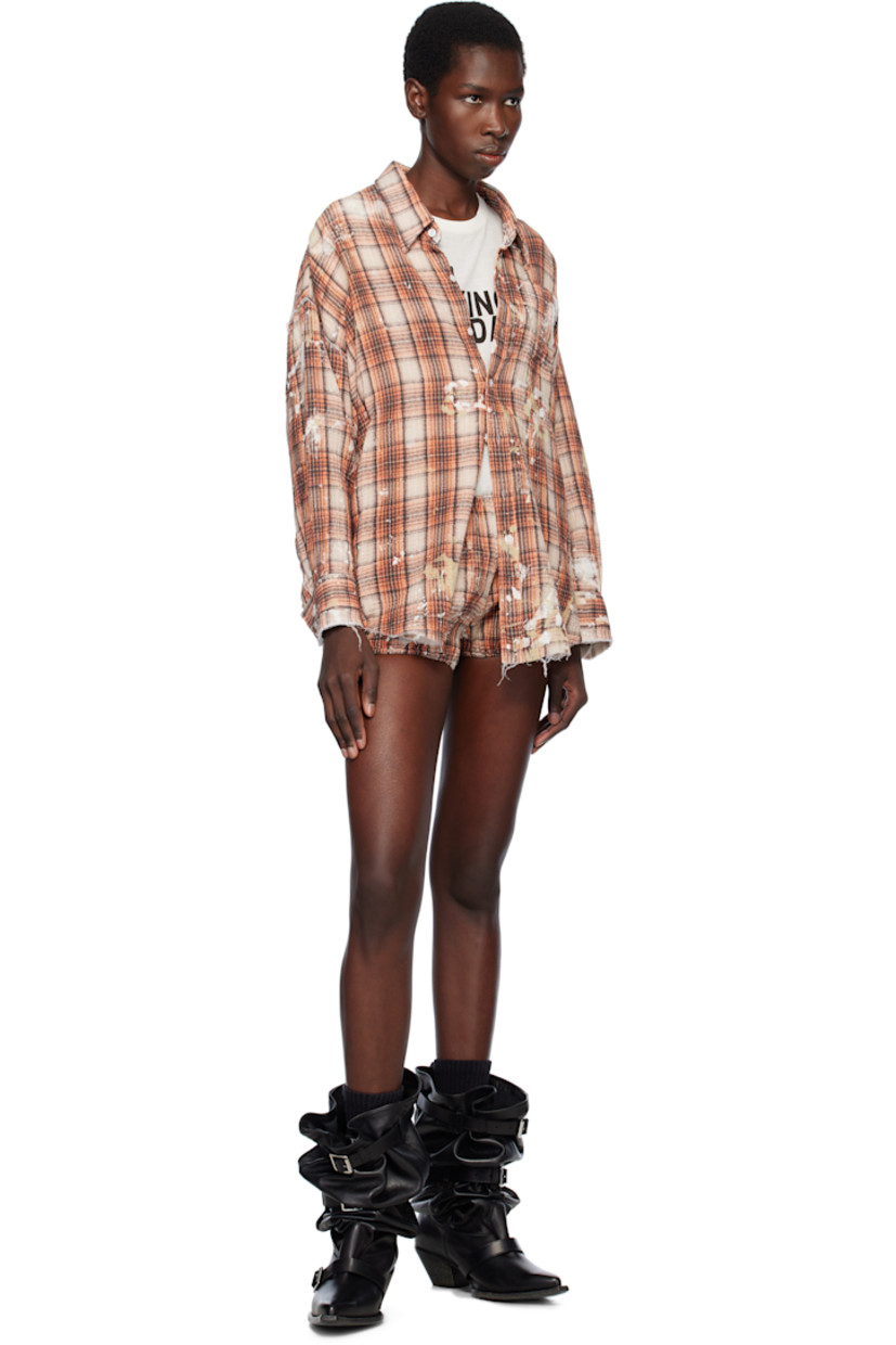 Cotton seersucker shorts. 

· Check pattern and paint splatter throughout
· Elasticized waistband and cuffs

Supplier color: Orange plaid w/ paint splatter