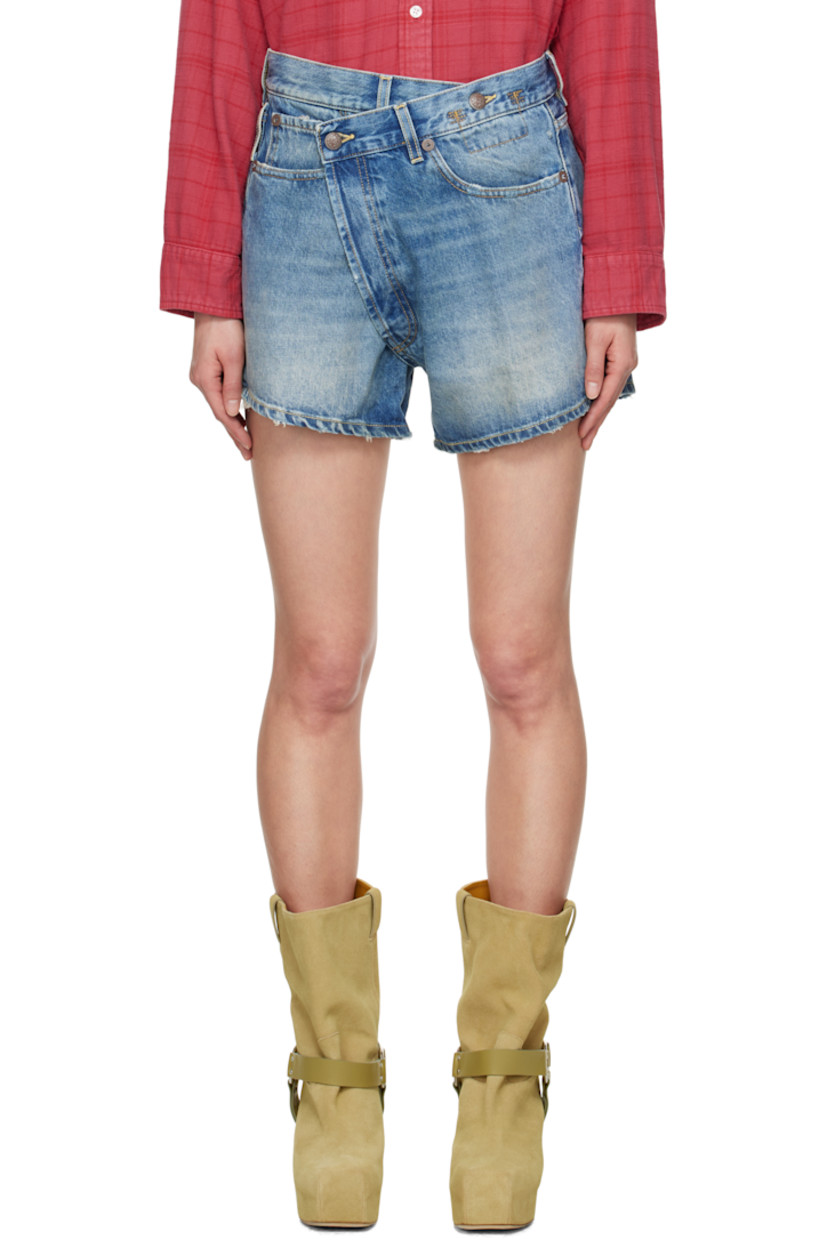 Non-stretch denim shorts. Fading, whiskering, and subtle distressing throughout.

· Belt loops
· Button fastening at asymmetric waistband
· Five-pocket styling
· Offset open fly
· Leather logo patch at back waistband
· Logo-engraved antiqued bronze-tone hardware
· Contrast stitching in tan

Supplier color: Bain blue