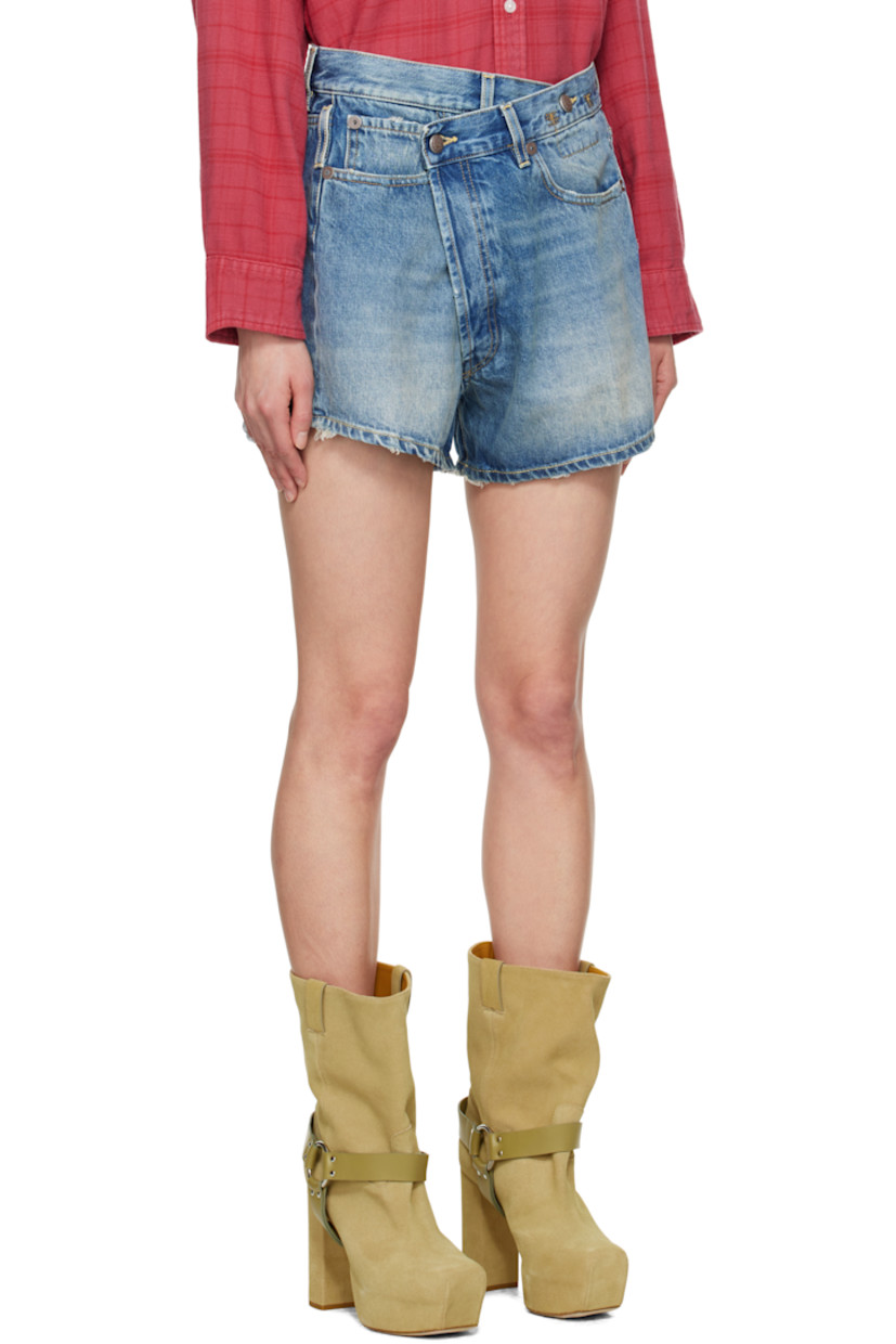Non-stretch denim shorts. Fading, whiskering, and subtle distressing throughout.

· Belt loops
· Button fastening at asymmetric waistband
· Five-pocket styling
· Offset open fly
· Leather logo patch at back waistband
· Logo-engraved antiqued bronze-tone hardware
· Contrast stitching in tan

Supplier color: Bain blue