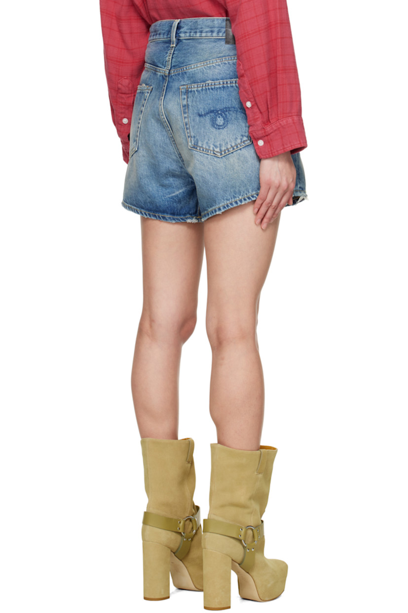 Non-stretch denim shorts. Fading, whiskering, and subtle distressing throughout.

· Belt loops
· Button fastening at asymmetric waistband
· Five-pocket styling
· Offset open fly
· Leather logo patch at back waistband
· Logo-engraved antiqued bronze-tone hardware
· Contrast stitching in tan

Supplier color: Bain blue