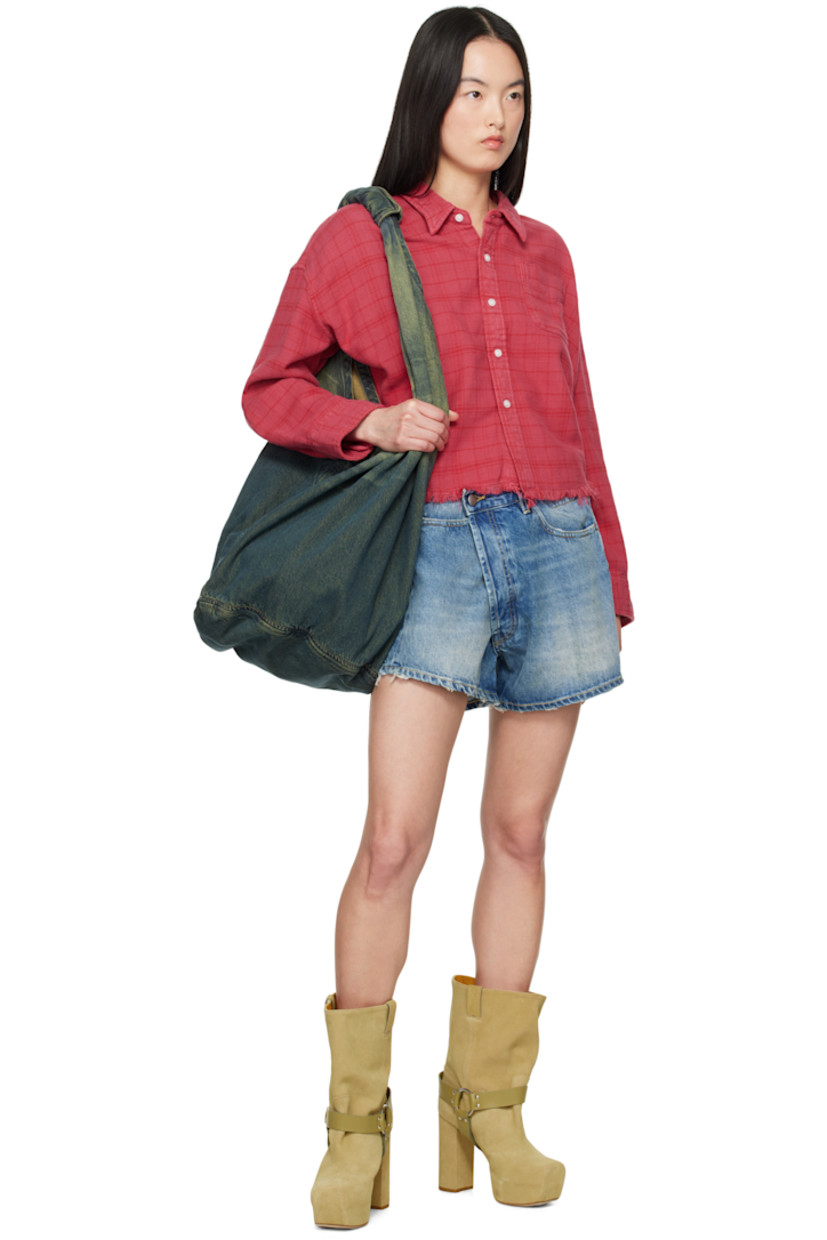 Non-stretch denim shorts. Fading, whiskering, and subtle distressing throughout.

· Belt loops
· Button fastening at asymmetric waistband
· Five-pocket styling
· Offset open fly
· Leather logo patch at back waistband
· Logo-engraved antiqued bronze-tone hardware
· Contrast stitching in tan

Supplier color: Bain blue
