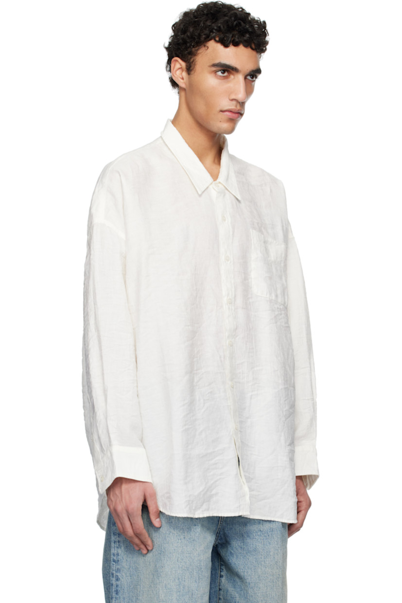 Oversized crinkled plain-woven linen-blend shirt. 

· Spread collar
· Button closure
· Patch pocket at chest 
· Droptail hem
· Single-button barrel cuffs

Supplier color: White