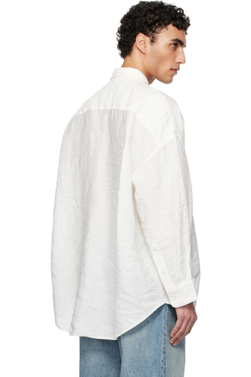 Oversized crinkled plain-woven linen-blend shirt. 

· Spread collar
· Button closure
· Patch pocket at chest 
· Droptail hem
· Single-button barrel cuffs

Supplier color: White