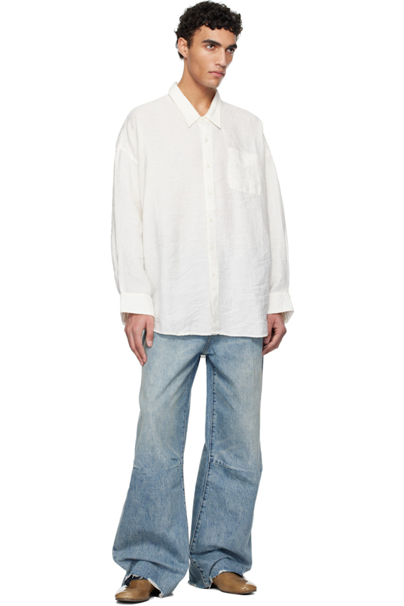 Oversized crinkled plain-woven linen-blend shirt. 

· Spread collar
· Button closure
· Patch pocket at chest 
· Droptail hem
· Single-button barrel cuffs

Supplier color: White