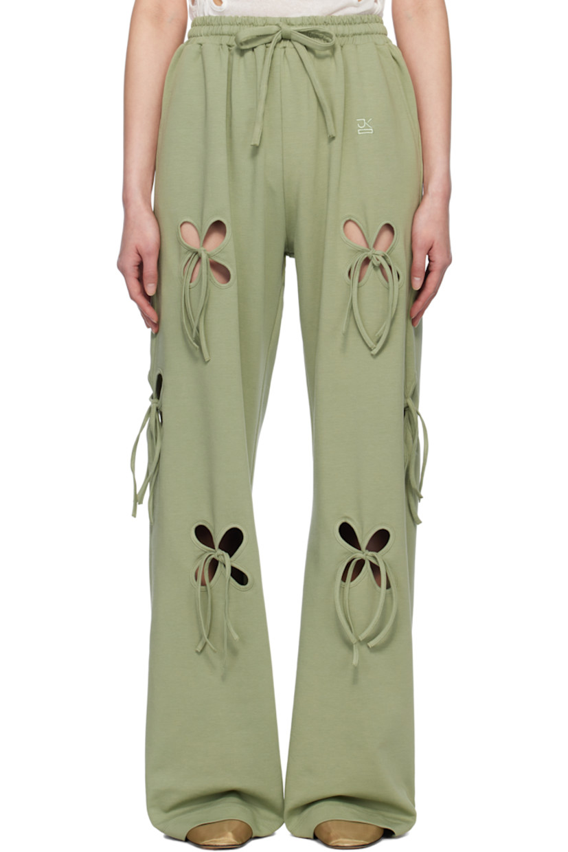 Loose-fit stretch cotton jersey lounge pants. Floral cutouts with self-tie fastening throughout. 

· Drawstring at elasticized waistband
· Two-pocket styling
· Logo embroidered at front

Supplier color: Swamp