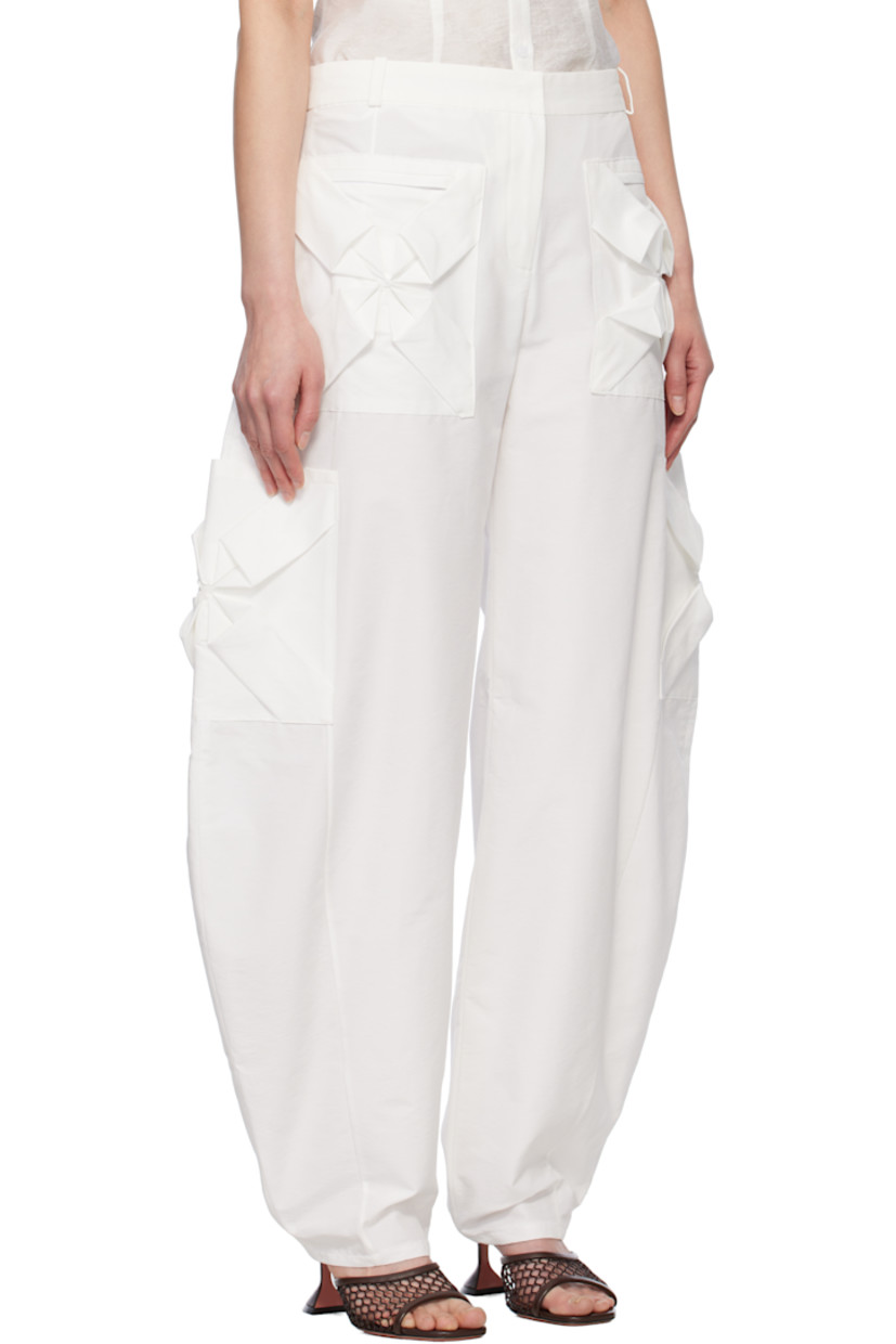 Nylon- and cotton-blend twill cargo pants. 

· Mid-rise
· Belt loops
· Four-pocket styling
· Hand-stitched floral smocking at pockets
· Zip fly
· Cargo pockets at curved outseams

Supplier color: White