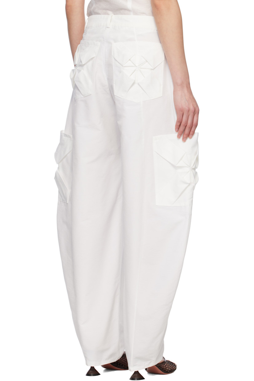 Nylon- and cotton-blend twill cargo pants. 

· Mid-rise
· Belt loops
· Four-pocket styling
· Hand-stitched floral smocking at pockets
· Zip fly
· Cargo pockets at curved outseams

Supplier color: White