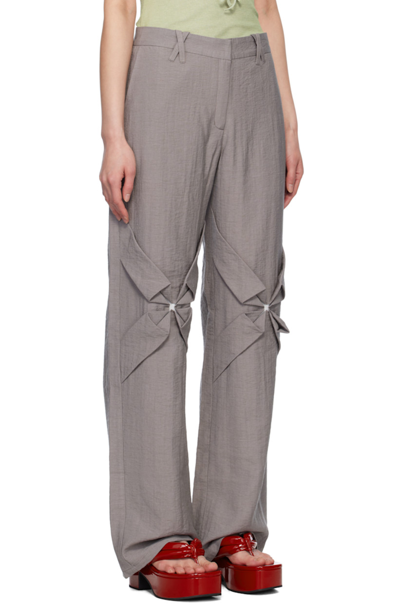 Straight-leg crinkled plain-woven rayon- and nylon-blend trousers. 

· Mid-rise
· Belt loops
· Four-pocket styling
· Zip fly
· Hand-stitched floral smocking at knees
· Hand-stitched pleats at back pockets

Supplier color: Stone gray