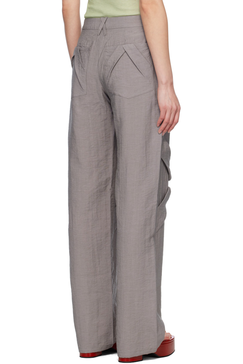 Straight-leg crinkled plain-woven rayon- and nylon-blend trousers. 

· Mid-rise
· Belt loops
· Four-pocket styling
· Zip fly
· Hand-stitched floral smocking at knees
· Hand-stitched pleats at back pockets

Supplier color: Stone gray