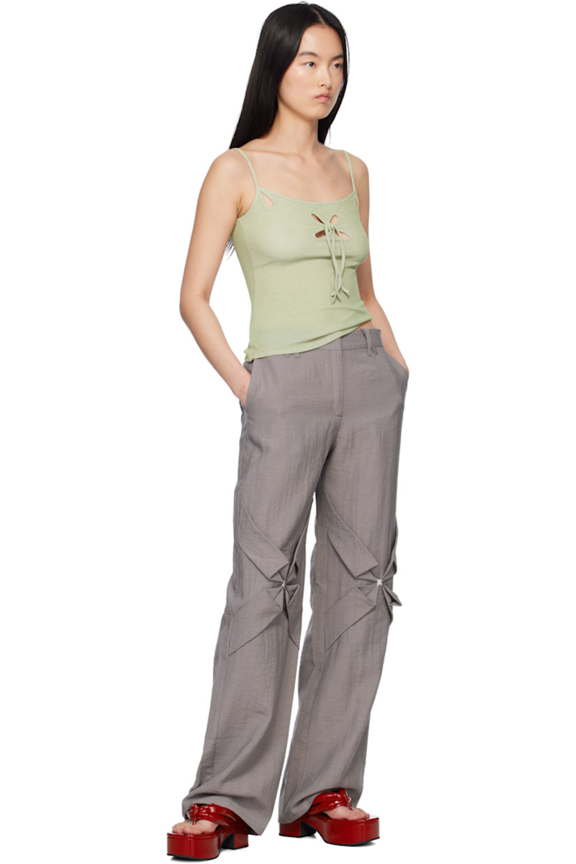 Straight-leg crinkled plain-woven rayon- and nylon-blend trousers. 

· Mid-rise
· Belt loops
· Four-pocket styling
· Zip fly
· Hand-stitched floral smocking at knees
· Hand-stitched pleats at back pockets

Supplier color: Stone gray