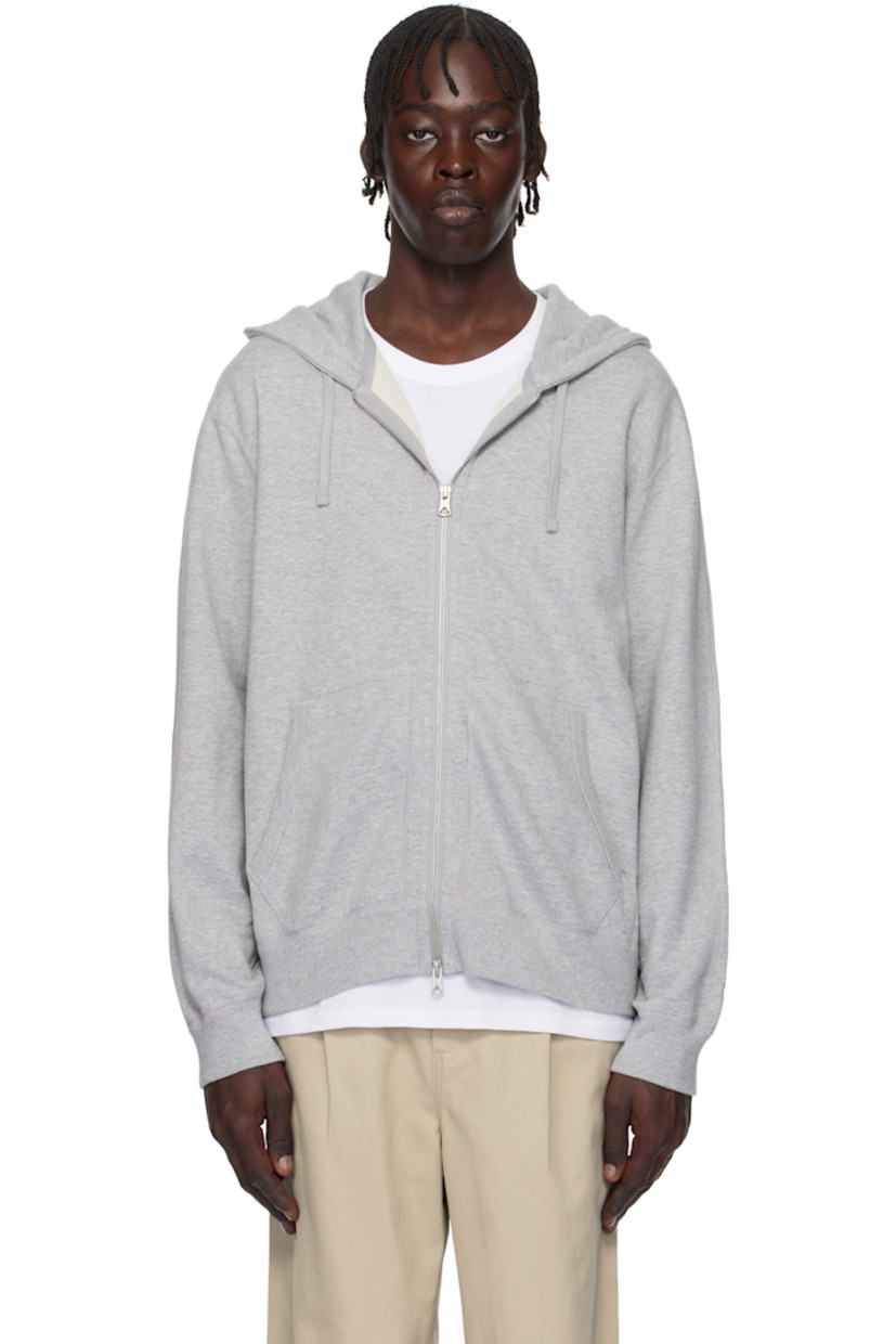 French terry hoodie. Flatlock seams throughout. 

· Drawstring at hood
· Two-way zip closure
· Patch pockets
· Rib-knit hem, side seams, and cuffs
· Logo patch at hem

Supplier color: Heather grey