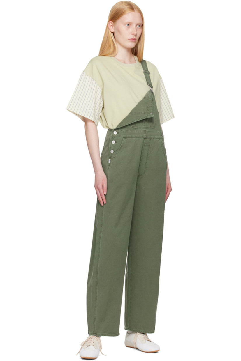Non-stretch regenerative cotton denim overalls. Fading and whiskering throughout.

· Square neck
· Patch pocket at chest
· Four-pocket styling
· Mock fly
· Button fastening at outseams
· Logo patch at outseam
· Adjustable shoulder straps
· Logo-engraved silver-tone hardware

Supplier color: Cadet