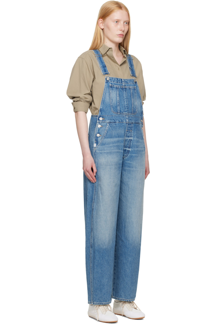 Non-stretch regenerative cotton denim overalls. Fading and whiskering throughout.

· Square neck
· Patch pocket at chest
· Four-pocket styling
· Mock fly
· Button fastening at outseams
· Logo patch at outseam
· Adjustable shoulder straps
· Logo-engraved silver-tone hardware
· Contrast stitching in beige

Supplier color: Arta