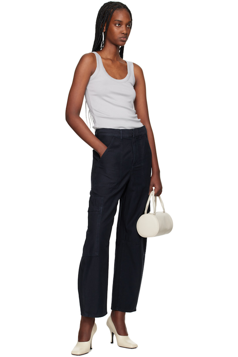 Tapered non-stretch regenerative cotton twill trousers. 

· Loose-fit and straight-leg
· Belt loops
· Four-pocket styling
· Zip fly
· Dart at front and back knees
· Logo patch at outseam
· Flap pocket at outseams

Supplier color: True navy