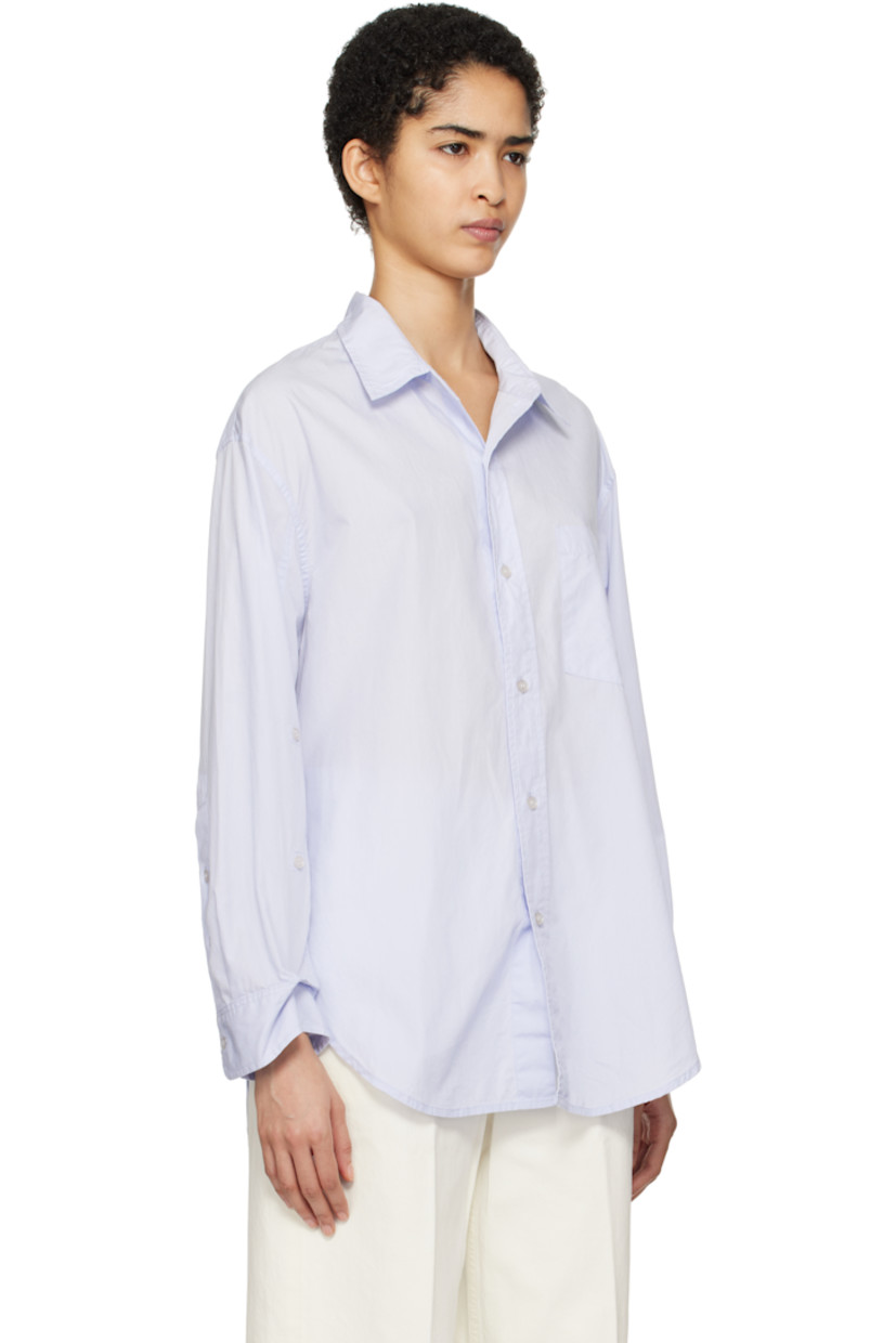 Loose-fit lightweight cotton poplin shirt.

· Spread collar
· Button closure
· Patch pocket at chest
· Droptail hem
· Dropped shoulders
· Button fastenings at sleeves
· Single-button barrel cuffs
· Locker loop and pleats at back yoke

Part of the HUMANITY collection.

Supplier color: Santa Cruz