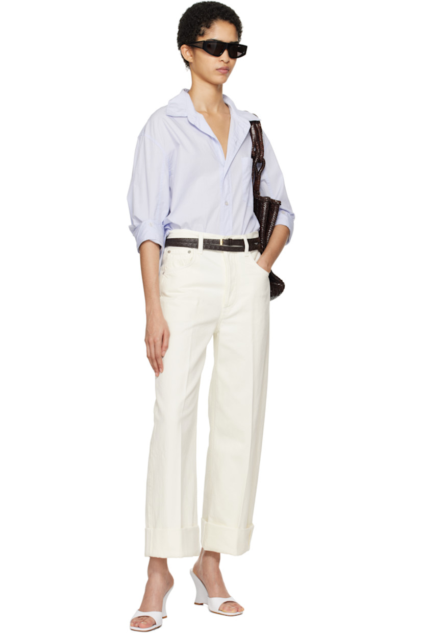 Loose-fit lightweight cotton poplin shirt.

· Spread collar
· Button closure
· Patch pocket at chest
· Droptail hem
· Dropped shoulders
· Button fastenings at sleeves
· Single-button barrel cuffs
· Locker loop and pleats at back yoke

Part of the HUMANITY collection.

Supplier color: Santa Cruz