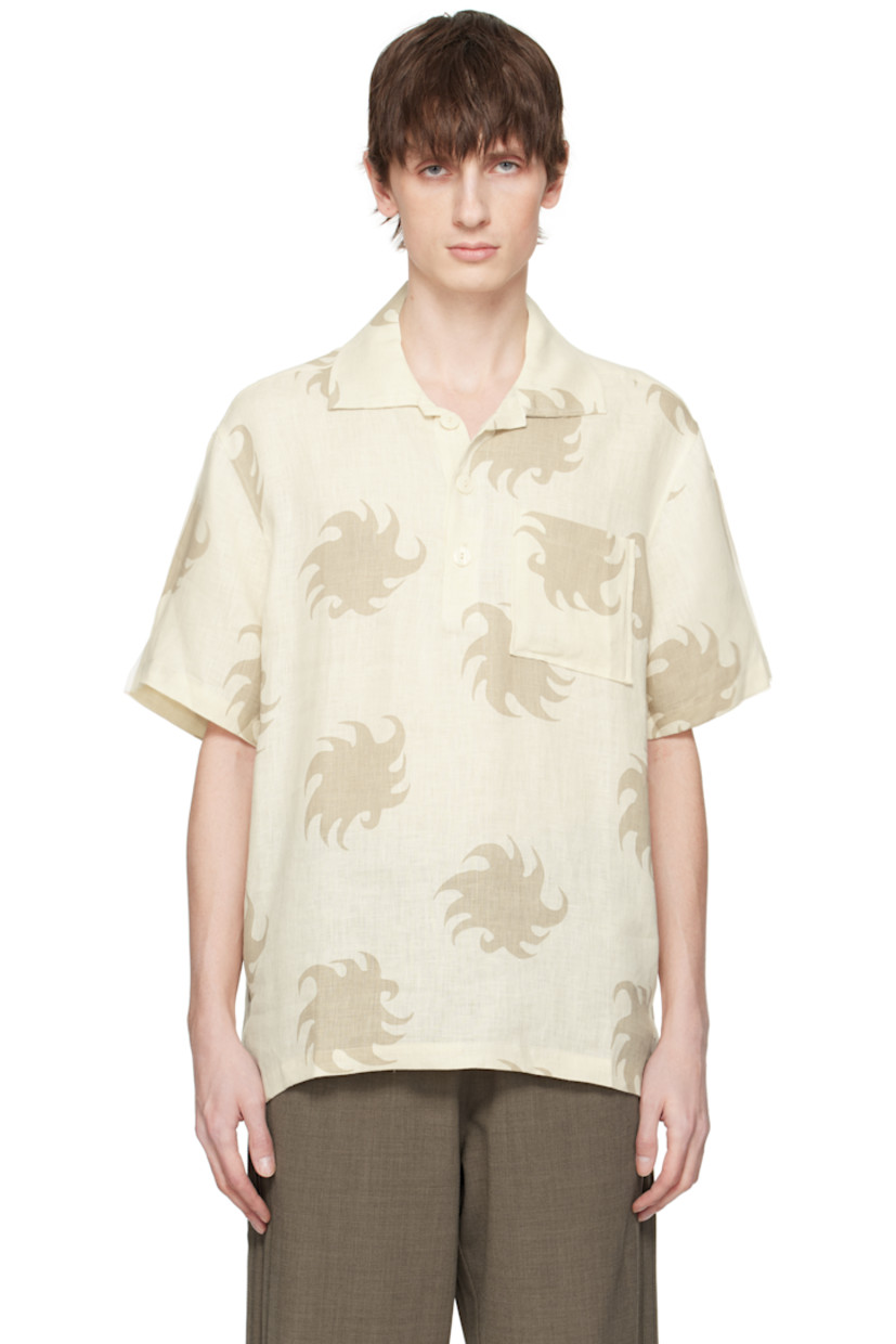 Plain-woven linen polo. Graphic pattern printed throughout.

· Spread collar
· Three-button placket
· Patch pocket at chest
· Tennis-tail hem
· Mother-of-pearl hardware

Supplier color: White