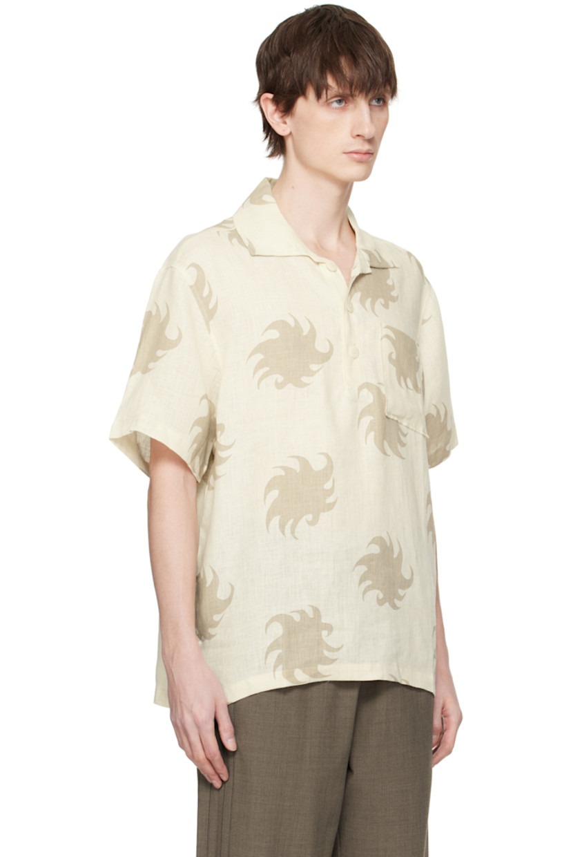Plain-woven linen polo. Graphic pattern printed throughout.

· Spread collar
· Three-button placket
· Patch pocket at chest
· Tennis-tail hem
· Mother-of-pearl hardware

Supplier color: White