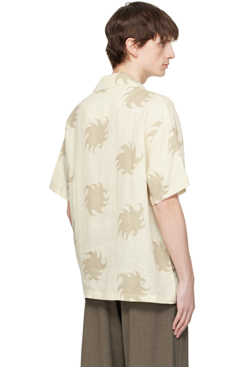 Plain-woven linen polo. Graphic pattern printed throughout.

· Spread collar
· Three-button placket
· Patch pocket at chest
· Tennis-tail hem
· Mother-of-pearl hardware

Supplier color: White