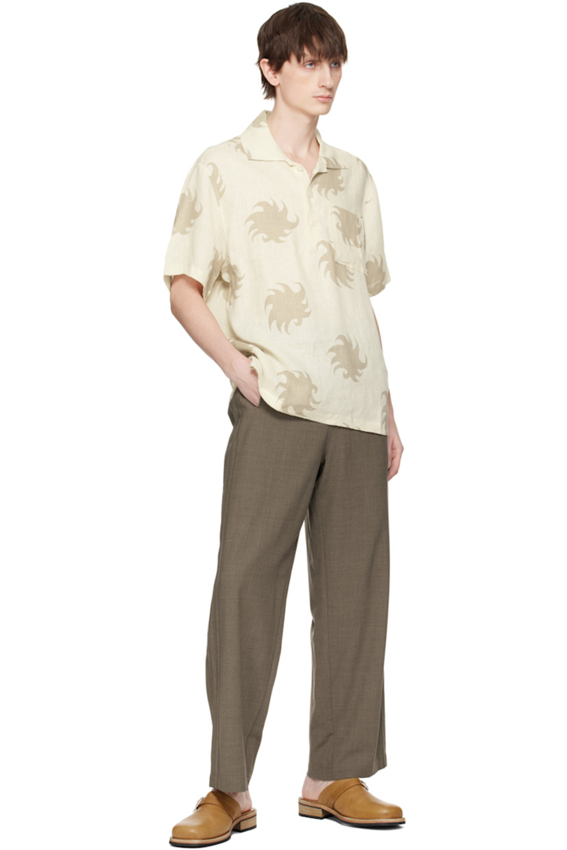 Plain-woven linen polo. Graphic pattern printed throughout.

· Spread collar
· Three-button placket
· Patch pocket at chest
· Tennis-tail hem
· Mother-of-pearl hardware

Supplier color: White