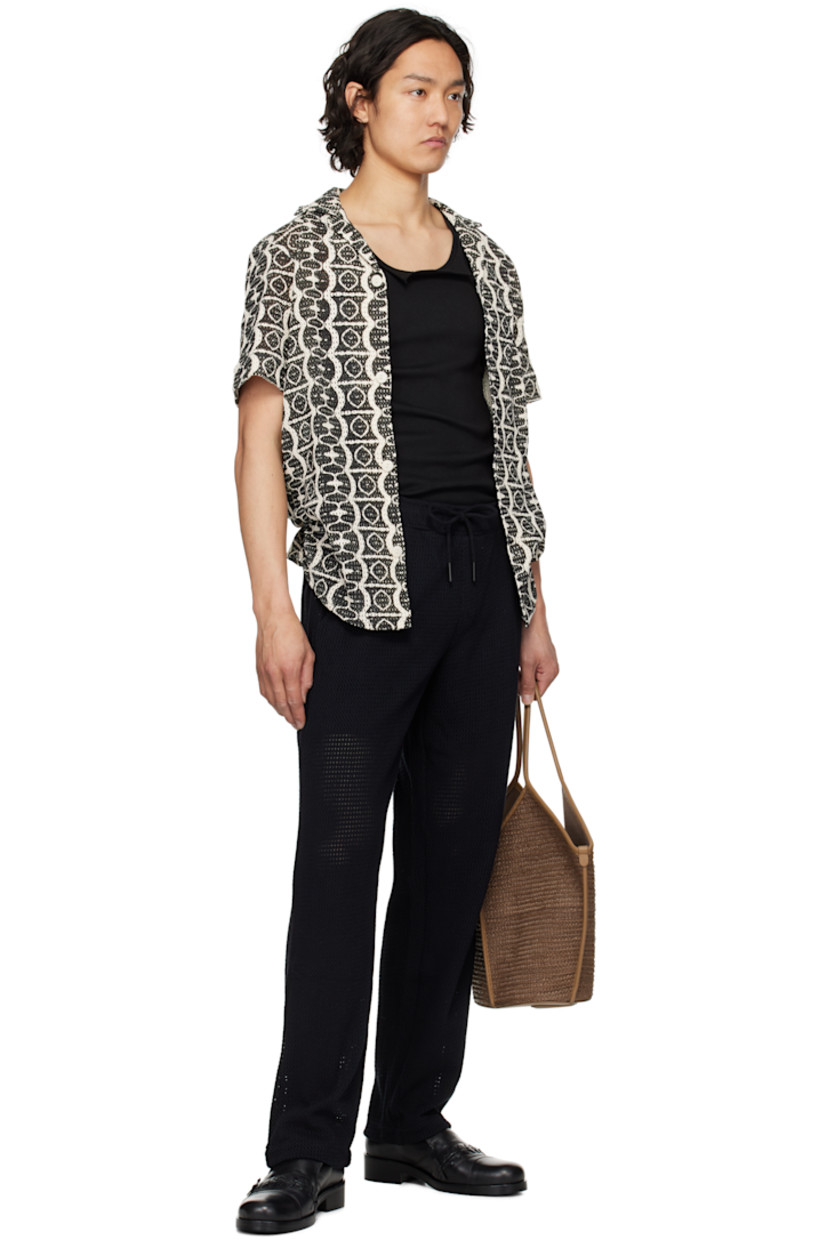 Open-knit cotton shirt. Graphic pattern printed throughout.

· Open spread collar
· Button closure
· Shirttail hem

Supplier color: Black