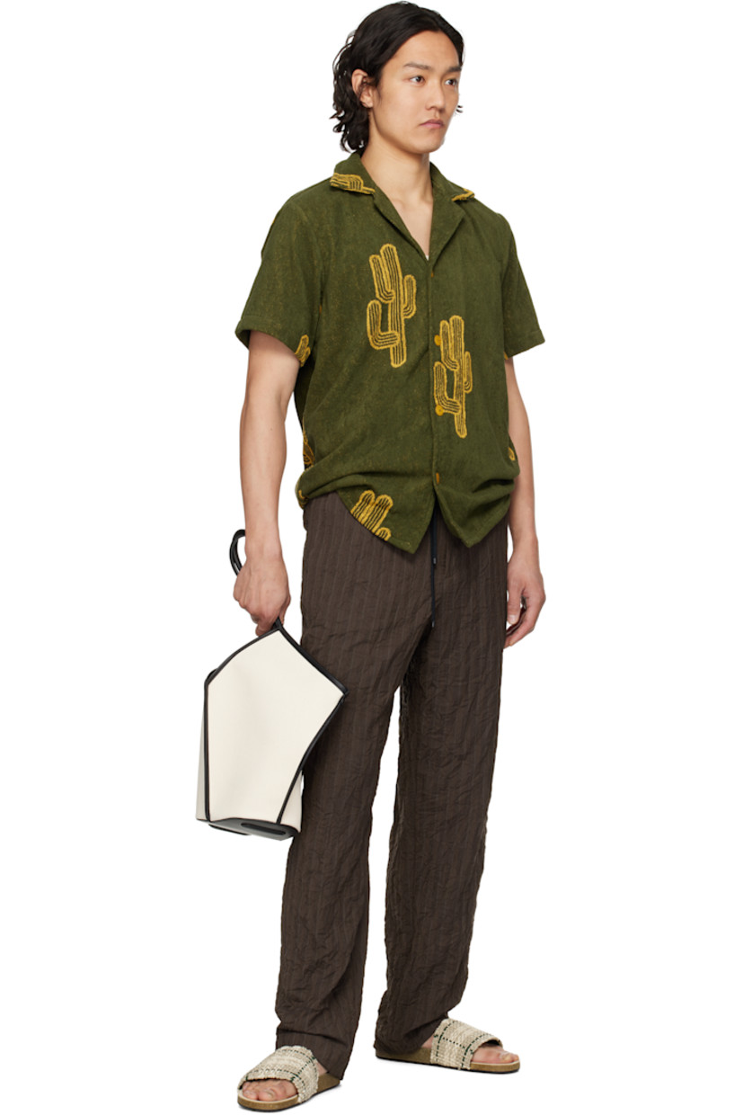 Heavyweight cotton terrycloth shirt. Jacquard graphic pattern throughout.

· Open spread collar
· Button closure
· Shirttail hem

Supplier color: Green