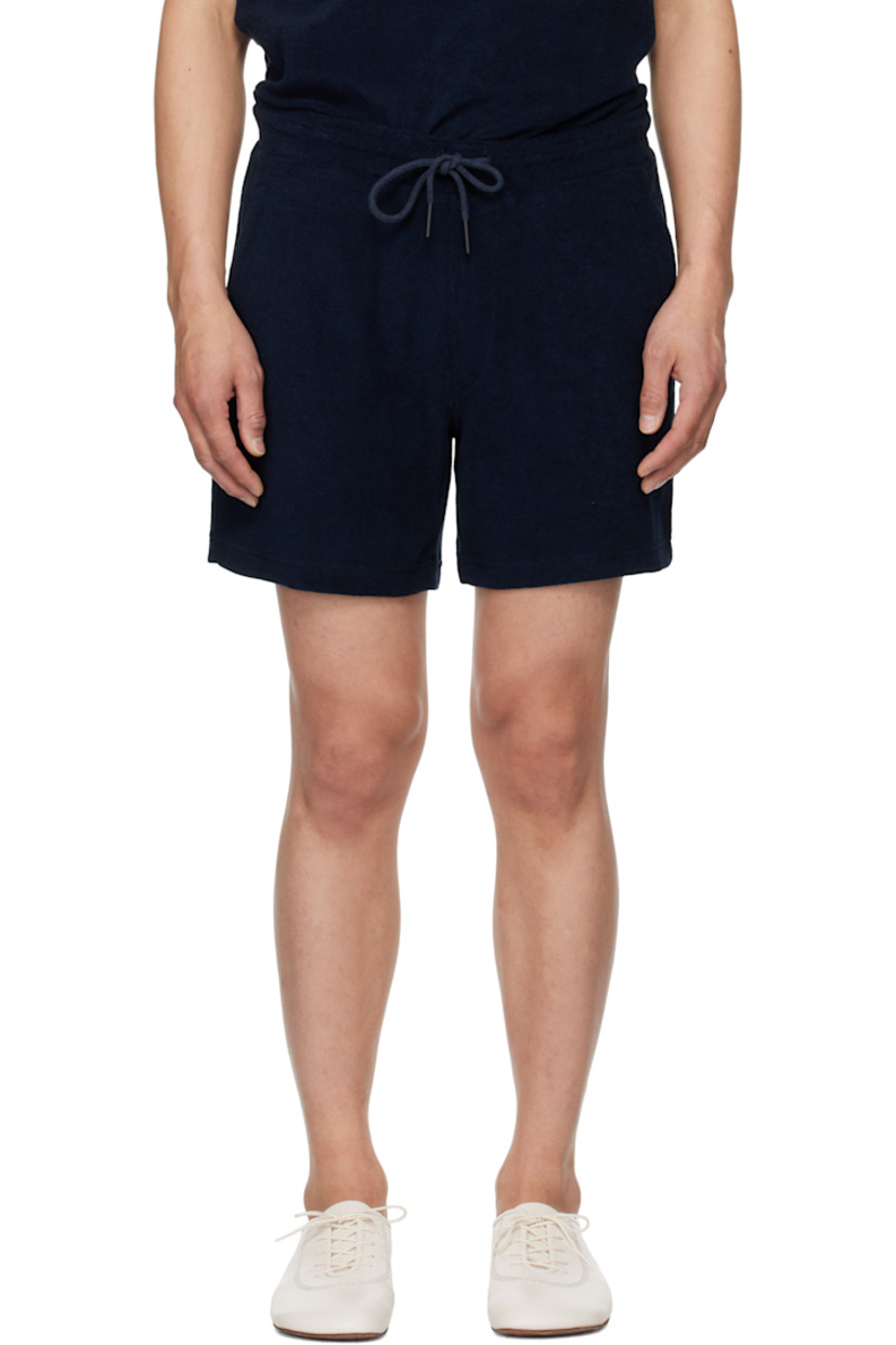 Cotton terrycloth shorts. 

· Mid-rise
· Drawstring at elasticized waistband
· Three-pocket styling
· Mock fly
· Integrated briefs-style mesh lining

Supplier color: Navy
