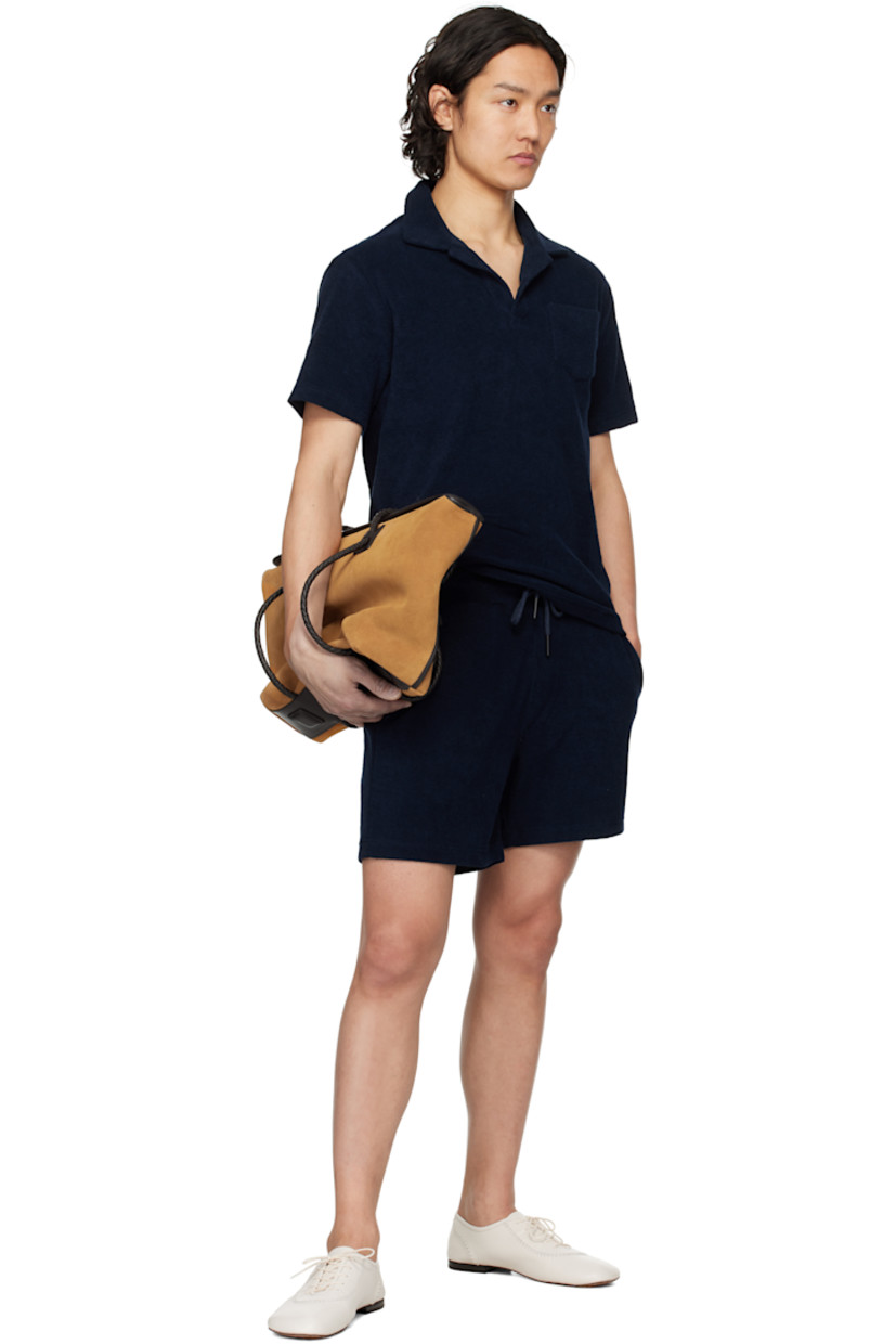 Cotton terrycloth shorts. 

· Mid-rise
· Drawstring at elasticized waistband
· Three-pocket styling
· Mock fly
· Integrated briefs-style mesh lining

Supplier color: Navy