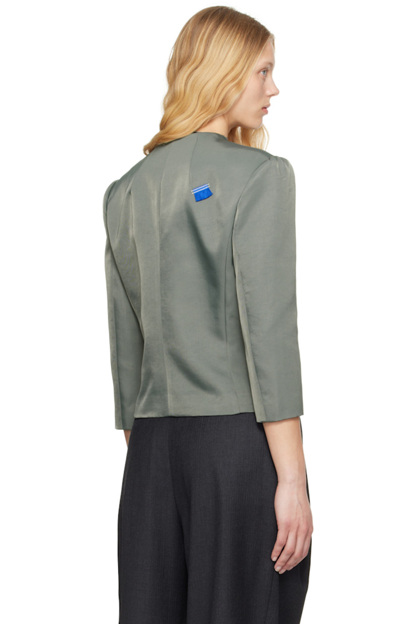 Crinkled plain-woven nylon-blend blazer.

· Raw edge at round neck
· Zip closure
· Hook-eye fastening at chest
· Darts at front and back
· Welt pockets
· Cutout at front hem
· Gathering at padded shoulders
· Frayed flag at back shoulder
· Welt pocket at interior
· Full satin lining

Supplier color: Charcoal
