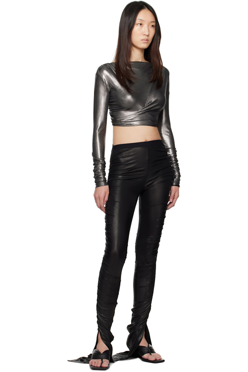 Foil-coated stretch viscose jersey leggings.

· FSC®-certified viscose
· Elasticized waistband
· Vent at cuffs
· Ruching at outseams

Supplier color: Black