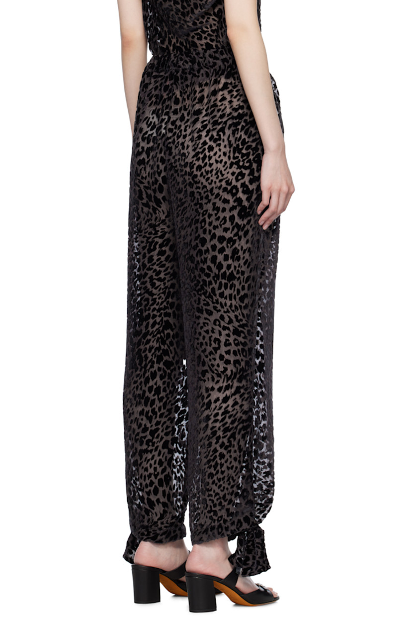 Semi-sheer viscose- and silk-blend chiffon trousers. Leopard pattern flocked throughout.

· Elasticized waistband
· Bow accent and press-stud fastening at cuffs

Supplier color: Brown Black